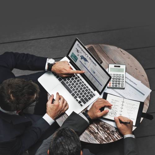 Business owner discussing tax planning and compliance with a consultant in Singapore